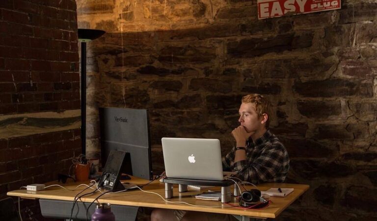 Digital Marketing team member working at desk with computer