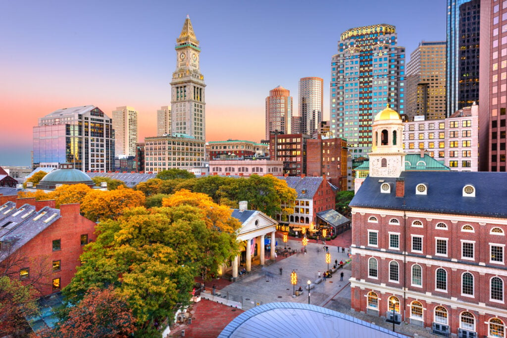 Boston, Massachusetts, USA skyline with Faneuil Hall and Quincy Market at dusk.