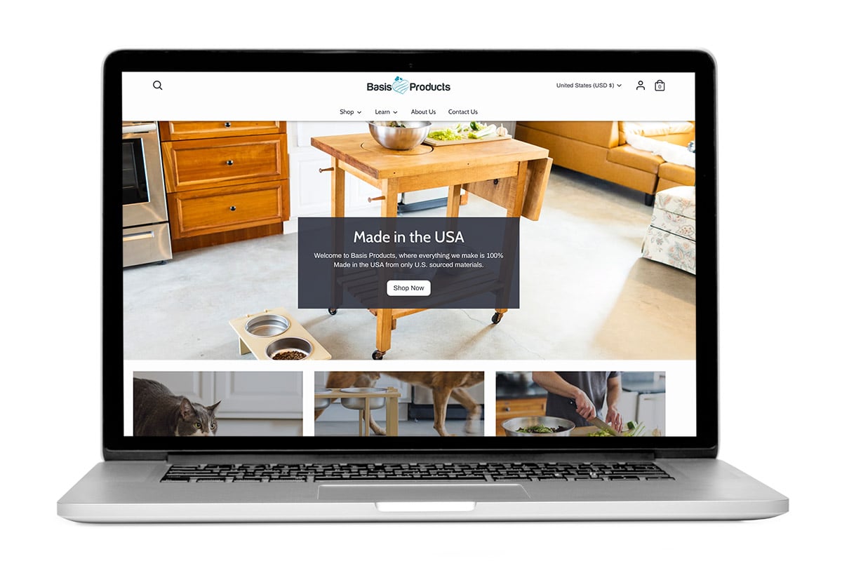 Laptop open to show the homepage of Basis Products, a Shopify development client of Bytes.co