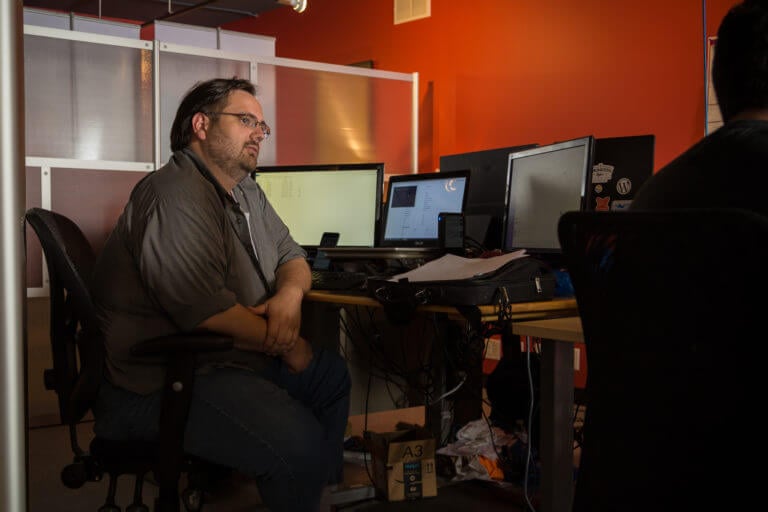 Greg working at desk