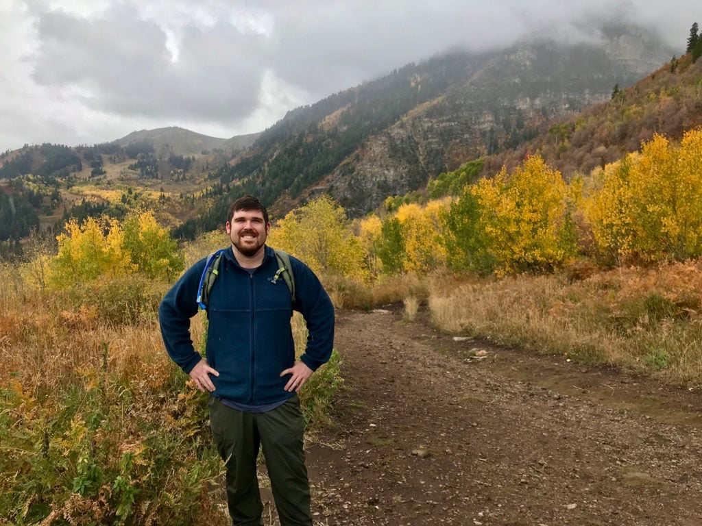 Eric Folenta hiking on a mountain