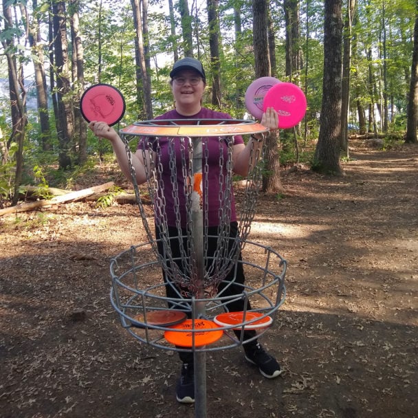 Hannah Hook holding frisbees