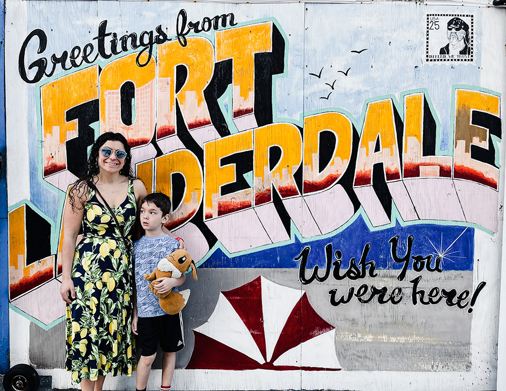 Erica and Gus in front of Fort Lauderdale sign