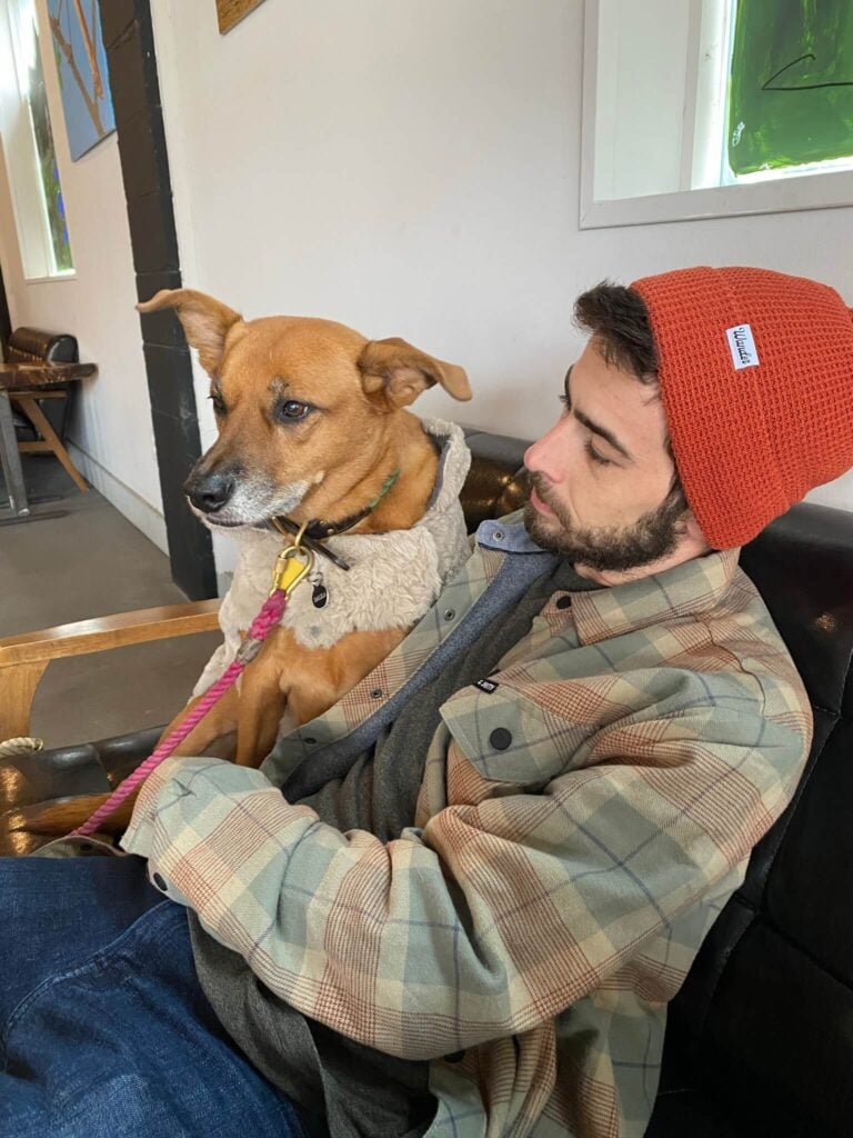 Tyler posing with his dog