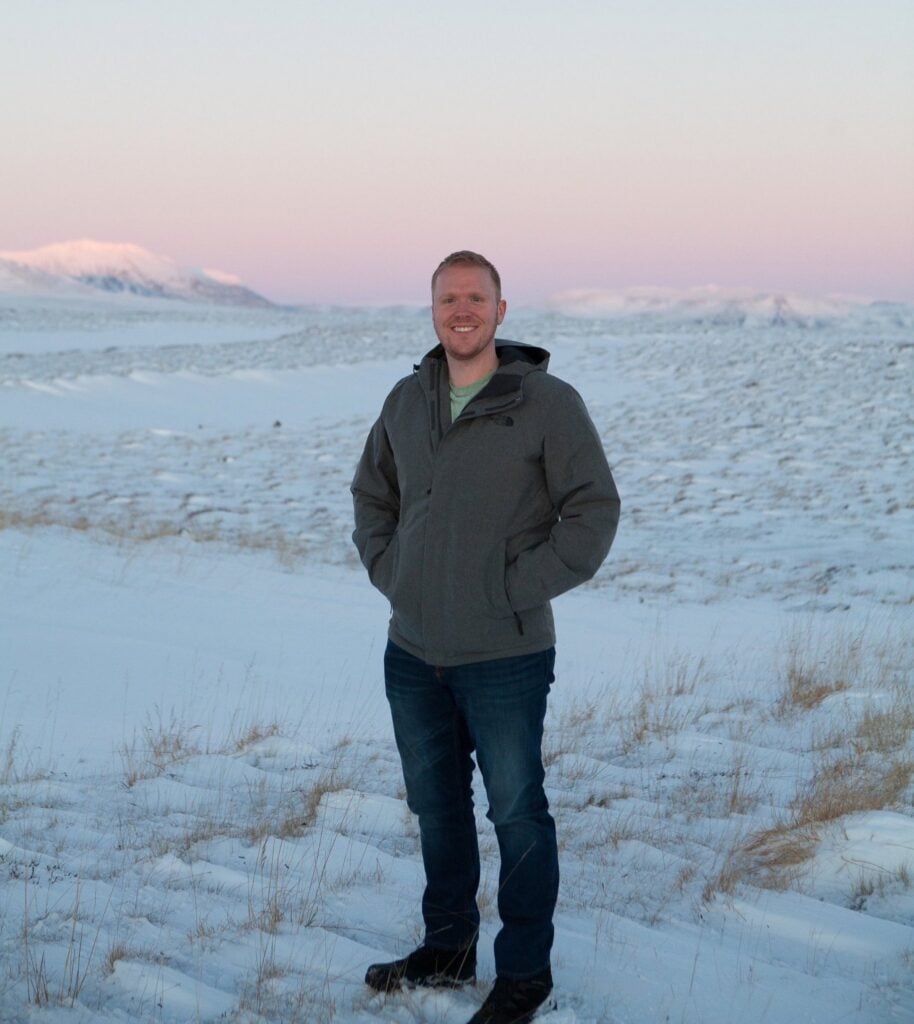 A portrait of Josh in a snowy backdrop