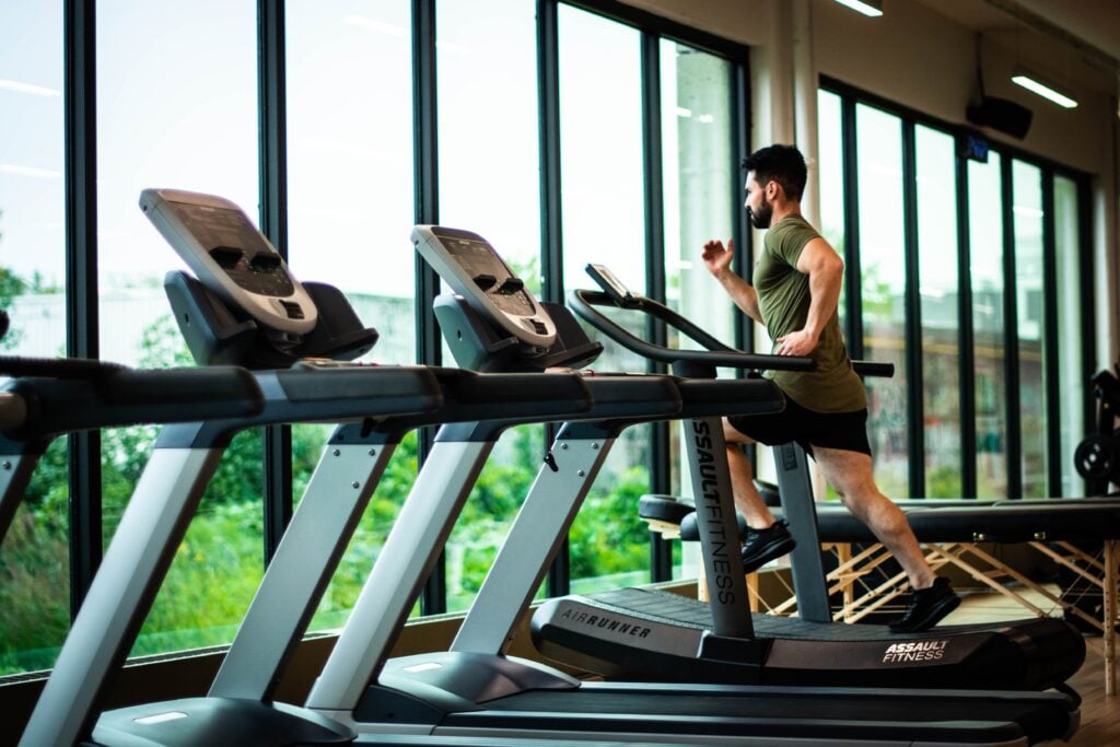 Man running on a treadmill at the gym