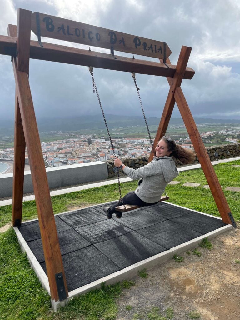 Sarah on a wooden swing